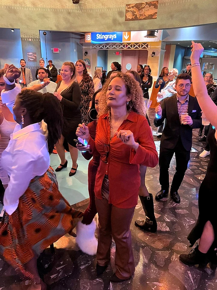 Guests dancing together at a company event.