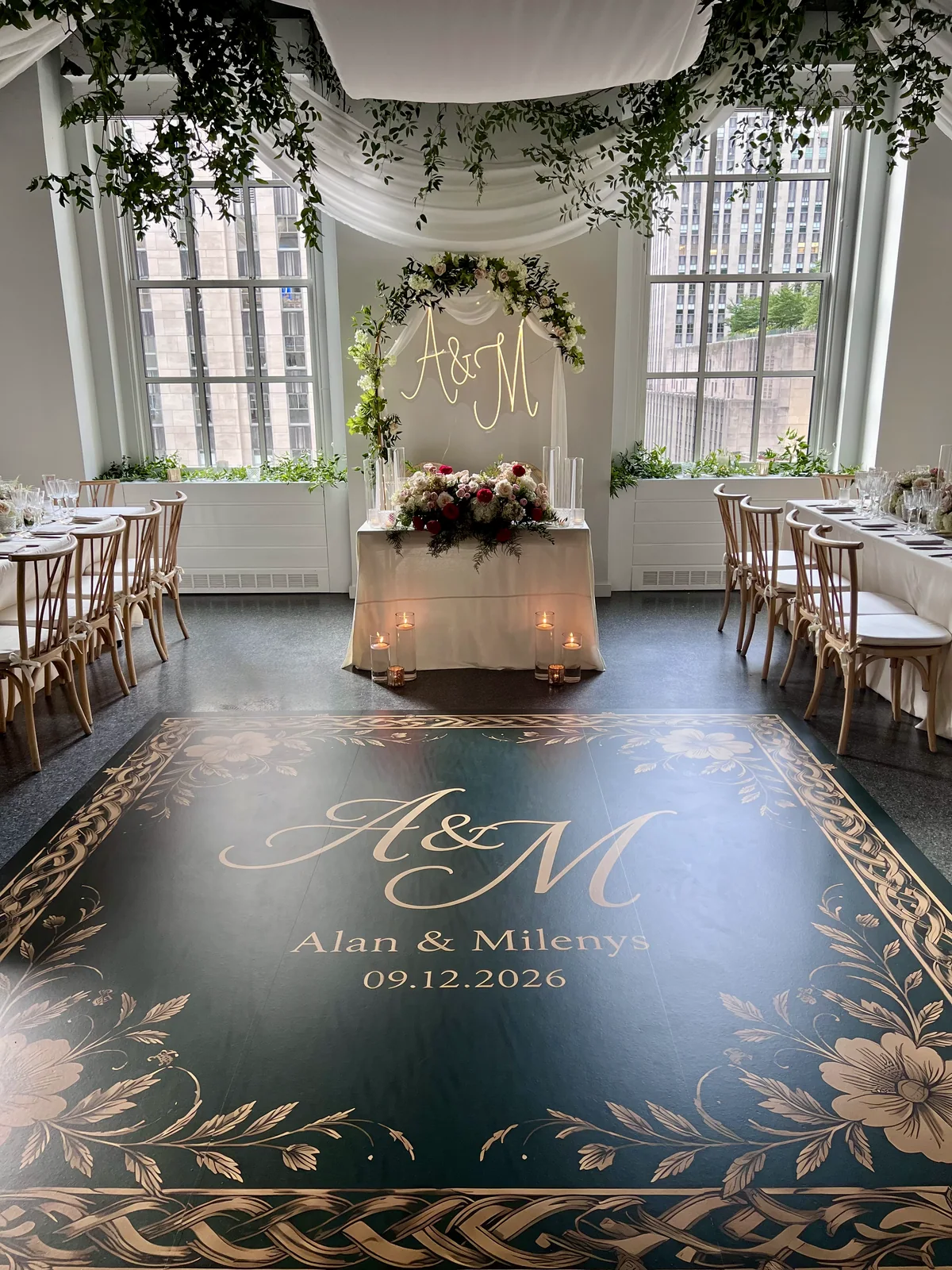 Custom monogram dance floor installed by All Generations for a wedding reception.