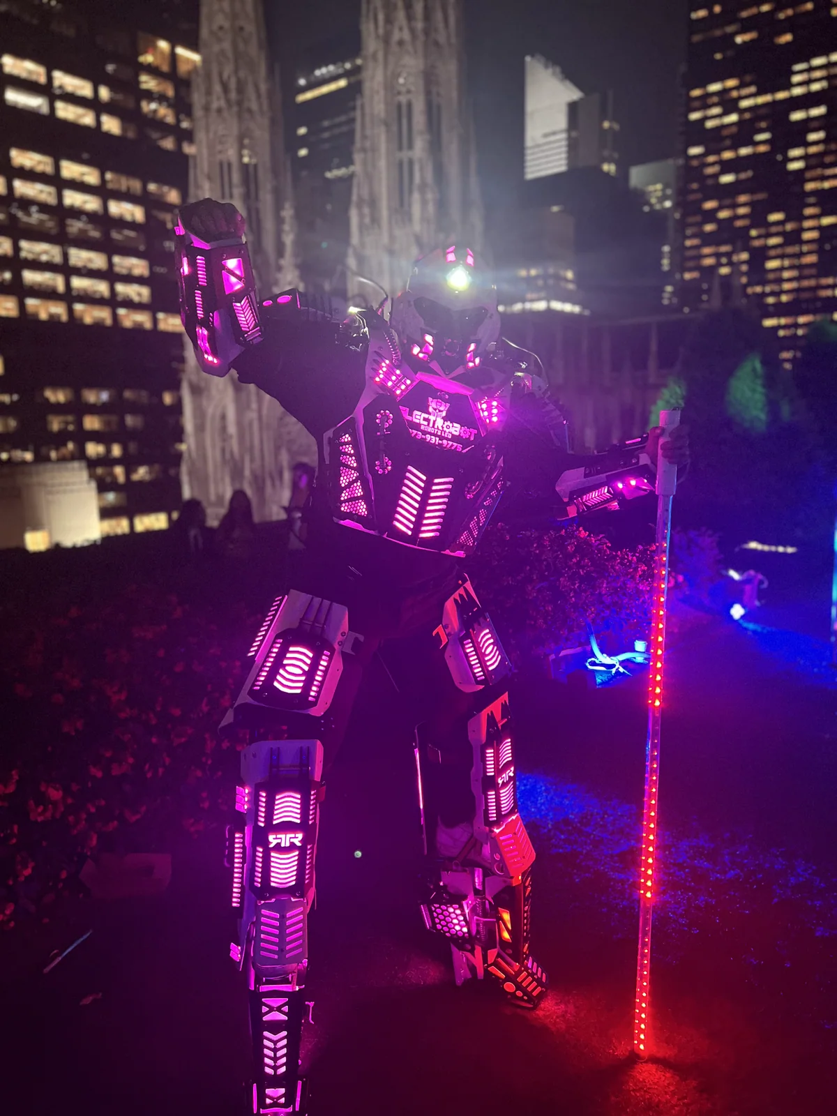 A real LED robot performer at an evening event.